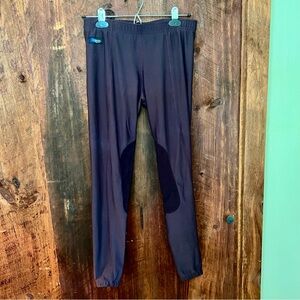 Women’s Irideon equestrian riding leggings with knee patches. Plum colored.